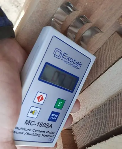 Moisture meter reading on a board