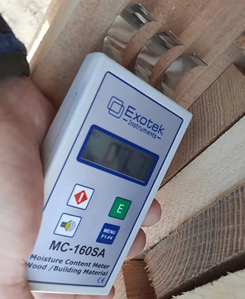 Moisture meter reading taken on a board