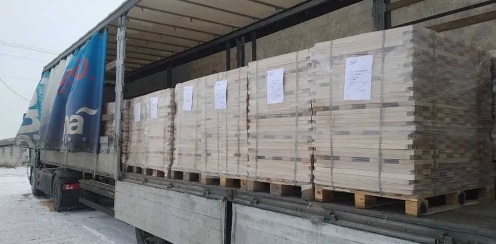 Labelled lumber packs prepared for delivery